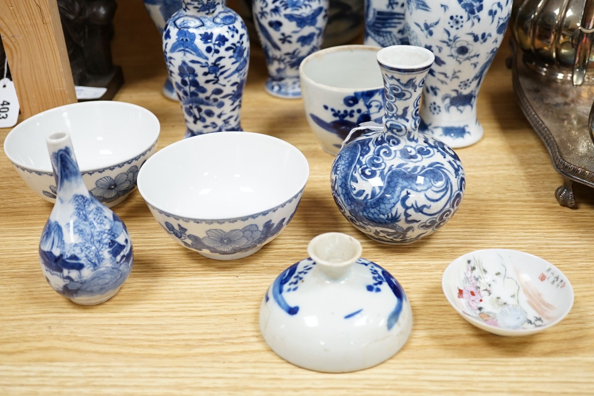 Twelve pieces of 19th century Chinese blue and white tableware and a small famille rose bowl, largest 20cm